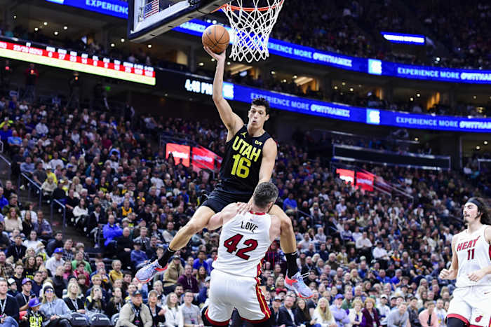Dec 31, 2022; Salt Lake City, Utah, USA; Utah Jazz forward Simone Fontecchio (16) gets fouled by Miami Heat forward/center Kevin Love (42) during the second half at Vivint Arena.